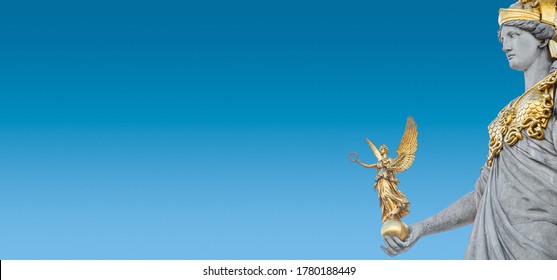 Banner with Athena statue at fountain (Pallas-Athene-Brunnen) in front of the Parliament, an ancient Greek goddess for victory and warfare during sunset at blue sky, with copy space, Vienna, Austria