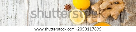 banner of Autumn hot drink tea with ginger, lemon, honey and spices on white wooden background. Copy space