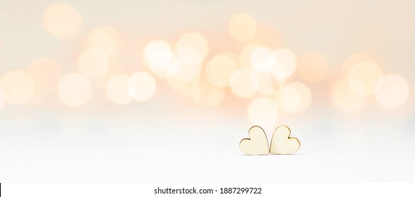 Banner. Background for Valentine's Day. two hearts with festive bokeh lights in the background. happy lovers day party invitation card layout, copy space.