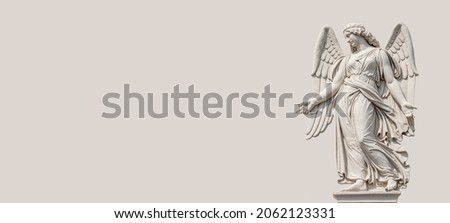 Banner with a beautiful angel as a bas relief wall sculpture, details, closeup, with copy space solid background. Concept of Religion and Religious Architecture