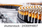 Banner Beer brewery conveyor. Brown glass alcohol bottles move on production line, modern equipment industrial drink with copy space.