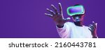 Banner of black man in vr headset exploring metaverse world, touching virtual reality subjects with copy space on the left