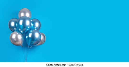 Banner with blue and silver grey balloons on blue background with copy space.