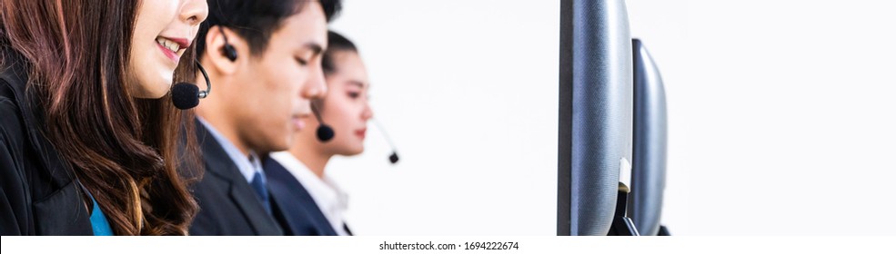 Banner Of Call Center Support Team At Service Desk Talking On Phone In A Call Centre With Friends Colleague, Operator Agent Working With Computer And Headsets, Customer Service Or Technician People