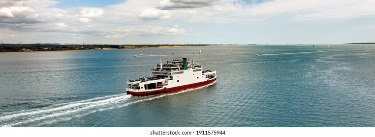 Banner - Car ferry in Southampton Water on a beautiful sunny day with clouds in the blue sky. Space for text.
