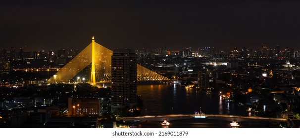 Banner of Citiscape of Bangkok, Thailand at Night with View of Rama VIII Bridge