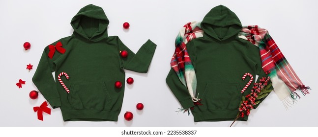 Banner Close up green blank template hoodie copy space. Christmas Holiday concept. Top view set mockup hoodie, scarf, hat. Red holidays decorations white background. Happy New Year accessories.