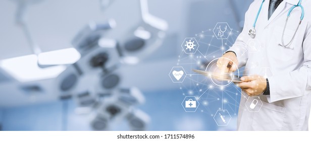 Banner Close Up Of Healthcare And Medical Doctor Using Smart Tablet Device For Research Development On Coronavirus And Diagnosis On Patient Health Concept, Surgeon Scrub And Stethoscope In Hospital  