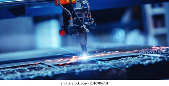 Banner CNC plasma cutting metal iron material with sparks, industry background. - Shutterstock ID 2010984701