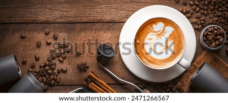Banner coffee,Cappuccino coffee in a white glass, placed on a wooden table. Favorite coffee concept in the morning.
