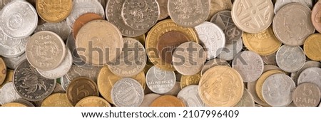 Banner with coins as background. Various vintage coins from worldwide as background. Coins from Korea, Turkey, Japan etc. Business concept. Numismatics, coins collecting