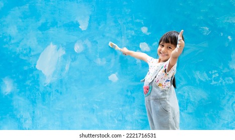 Banner Of Cute 5 Years Old Asian Little Girl Is Smiling While Painting The Wall With Water Color At Home, Concept Of Art Education For Kid, Homeschooling And Learning Activity By Playing For Child.