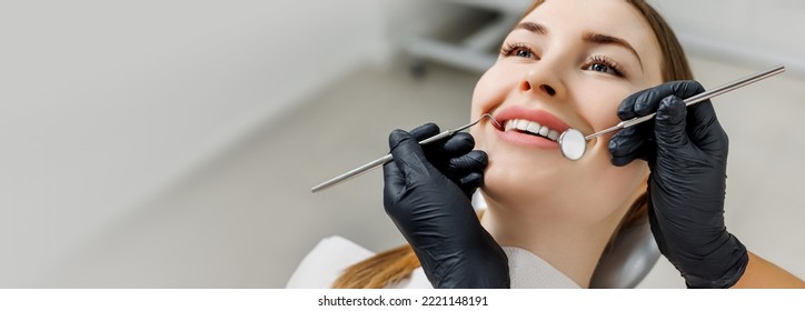 Banner for dental theme. Close-up of smiling woman with white teeth during medical examination. Concept of tooth whitening, treatment, veneers, professional clinic. Photo with empty copy space - Powered by Shutterstock