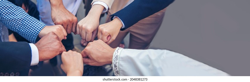 Banner diversity solidarity team multiethnic Partners hands together teamwork. Group of multiracial meetings joins hands together. Panorama Diversity people hands join empower trust team solidarity - Shutterstock ID 2048381273