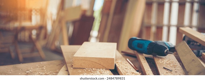 Banner DIY craftsperson wood heap carpenter objects woodwork handyman desk. Banner Architect carpentry tools home improvement equipments. Wooden carpenter construction workshop with copy space - Powered by Shutterstock