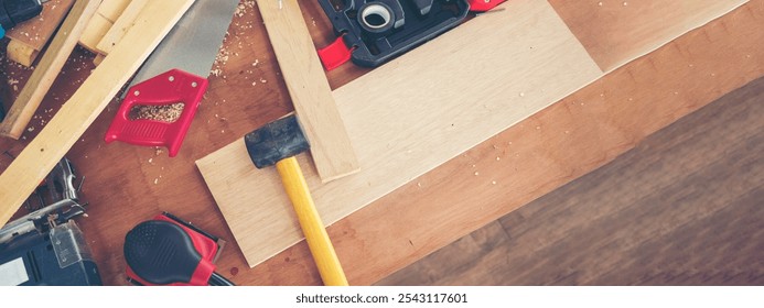 Banner DIY craftsperson wood heap carpenter objects woodwork handyman desk. Banner Architect carpentry tools home improvement equipments. Wooden carpenter construction workshop with copy space - Powered by Shutterstock