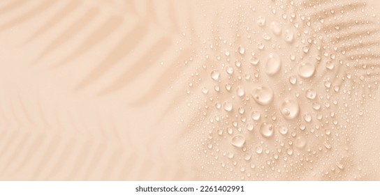banner drops on a pastel beige background with place for text - Shutterstock ID 2261402991