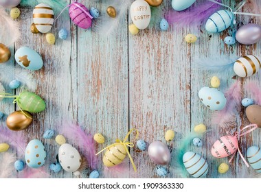Banner  Easter frame and eggs   feathers blue wooden background  The minimal concept  Top view  Card and copy the place for the text 