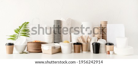 Banner. Eco friendly disposable tableware and eating utensils on table