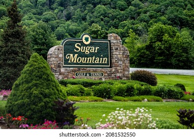 Banner Elk, USA - June 23, 2021: Downtown Banner Elk with sign to Sugar Mountain golf course and tennis in North Carolina city town famous for ski resorts