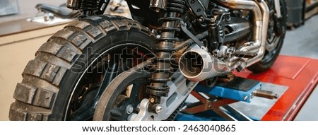 Image, Stock Photo Retro motorbike on platform lift in workshop