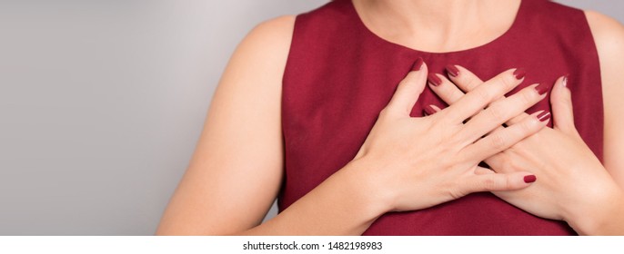 Banner Of Faithful Woman's Hands On Chest Near Heart Showing Thankful Or Kindness. Concept Of Health Care, Charity, Organ Donation, Grateful, Relief, Peaceful, Hopeful, Love, Honest, Appreciation.