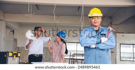 Banner Group of engineer team brainstorming at construction building with manager, contractor, worker meeting together at constrcution site. Team engineer look at Blueprint teamwork with copy space