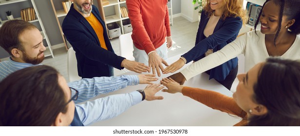 Banner With Group Of Positive Multiracial Teammates, Business Partners, Or Friends Joining Hands. Teamwork, Team Unity, Project Kickoff, Workshop With Coach And Mentor, Participation, Success Concept