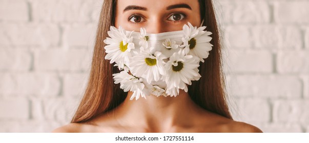 Banner Of Happy Beautiful Girl Wearing Protective Mask With Spring Daisy Flowers. Young Tender Woman In Summer Medical Face Mask. Natural Female Beauty. Skin Care, Health Care. Coronavirus COVID-19