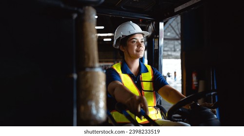 banner image. Beautiful female worker drives a forklift in a container warehouse. Export industry concept.  - Powered by Shutterstock