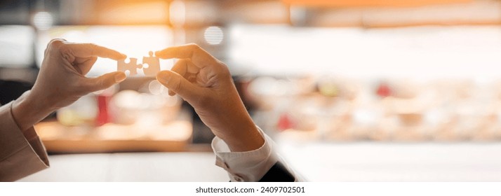 Banner Implement puzzle improve hand holding together solve synergy organize team connection plan trust strategy. Stakeholder business trust teams hands holding jigsaw puzzle synergy with copy space