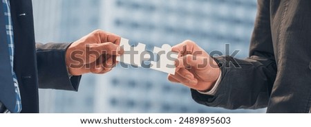 Banner Implement puzzle improve hand holding together solve synergy organize team connection plan trust strategy. Stakeholder business trust teams hands holding jigsaw puzzle synergy with copy space
