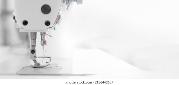 Banner industry tailor sewing machine on table workshop of white background.