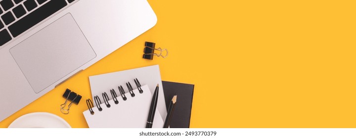 Banner with laptop, cup of coffee and stationery on a yellow background. Online education concept. - Powered by Shutterstock