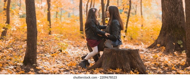 Banner Little Girl Playing With Mother In The Autumn Park, Copy Space