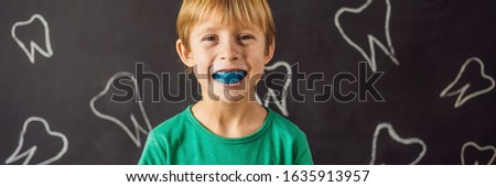 BANNER, LONG FORMAT Six-year old boy shows myofunctional trainer. Helps equalize the growing teeth and correct bite, develop mouth breathing habit. Corrects the position of the tongue