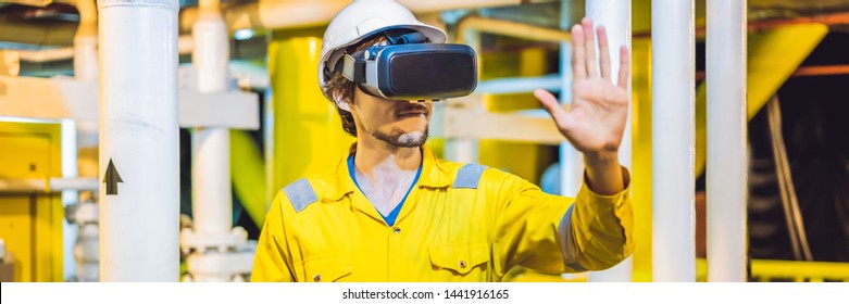 BANNER, LONG FORMAT Young Woman In A Yellow Work Uniform, Glasses And Helmet Uses Virtual Reality Glasses In Industrial Environment, Oil Platform Or Liquefied Gas Plant