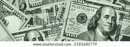 Banner of lots of hundred dollar bills. A lot of money on the table for background. USA money. Largest denomination. Toned image