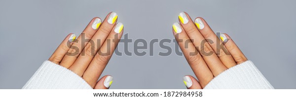 Banner made with perfect\
minimalistic manicure with geometry in trendy colors of year\
2021.