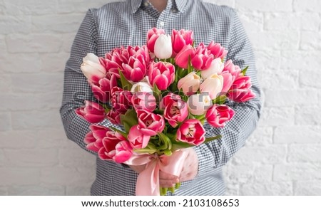 Similar – Image, Stock Photo Hold a bouquet of flowers in hand