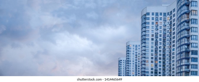 Banner of Modern and luxury building. copy space Modern european complex of apartment buildings. And outdoor facilities. Apartment building. Side view of big building with appartements at dusk