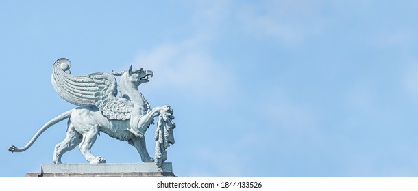 Banner With Old Statue Of Medieval Griffin, A Hybrid Of Lion And Bird, On The Top Of The State Opera House In Downtown Of Dresden, Germany, Details, Closeup, With Copy Space For Text