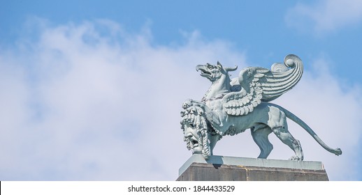 Banner With Old Statue Of Medieval Griffin, A Hybrid Of Lion And Bird, On The Top Of The State Opera House In Downtown Of Dresden, Germany, Details, Closeup, With Copy Space For Text