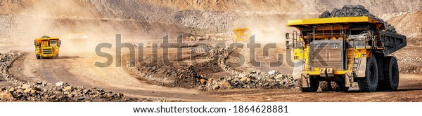 Banner open pit mine industry, big yellow\
mining truck for coal\
anthracite.