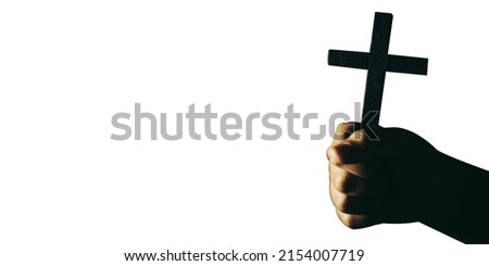 Banner panorama of human hand holding cross with isolated background. christian concept