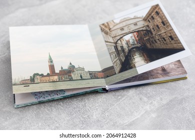 Banner Photobook Album With Travel Photo On Wooden Table Background