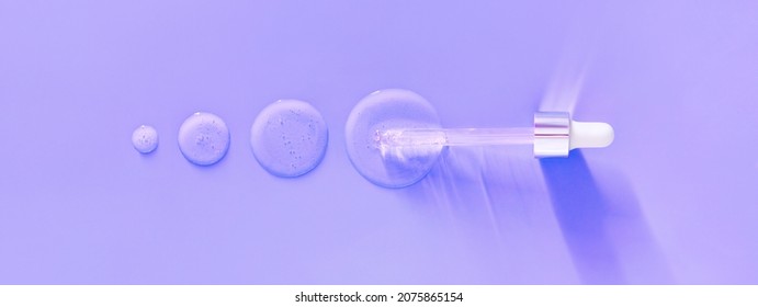 Banner Pipette Drops Of Serum On Purple Neon Background	
