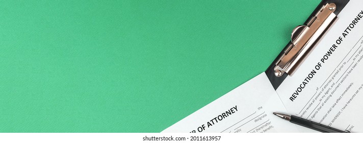 Banner revocation of power of attorney form. Office desk and clipboard with agreement. Top view and copy space