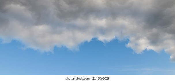 Banner Of A Severe Weather Cloud Front Advancing On A Blue Sky