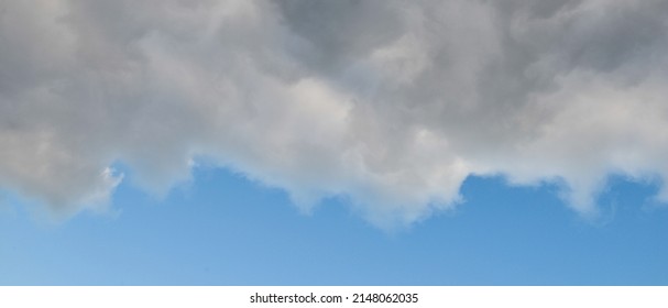 Banner Of A Severe Weather Cloud Front Advancing On A Blue Sky